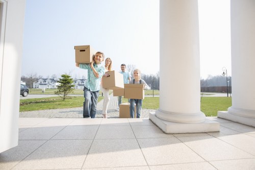 Professional movers handling furniture in a Shepherds Bush property