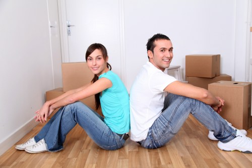 Careful unpacking of household items in a Shepherds Bush property