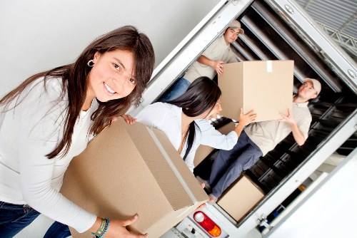 Household moving team loading boxes for a West London relocation