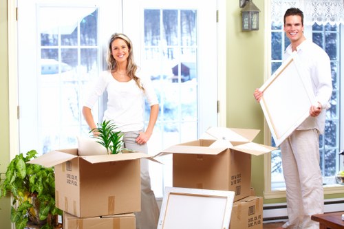 Business movers handling desks and equipment near Shepherds Bush offices