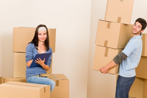 Loading furniture into a van in a West London residential street